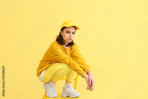 Stylish young woman sitting...