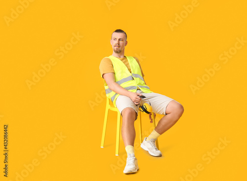 Stylish male worker sitting...