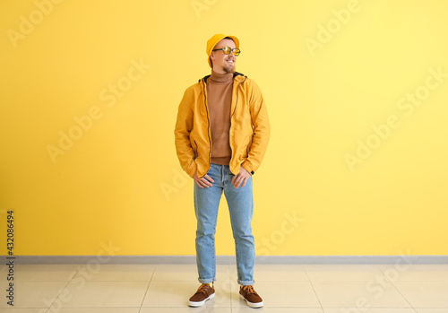 Stylish young man near yell...
