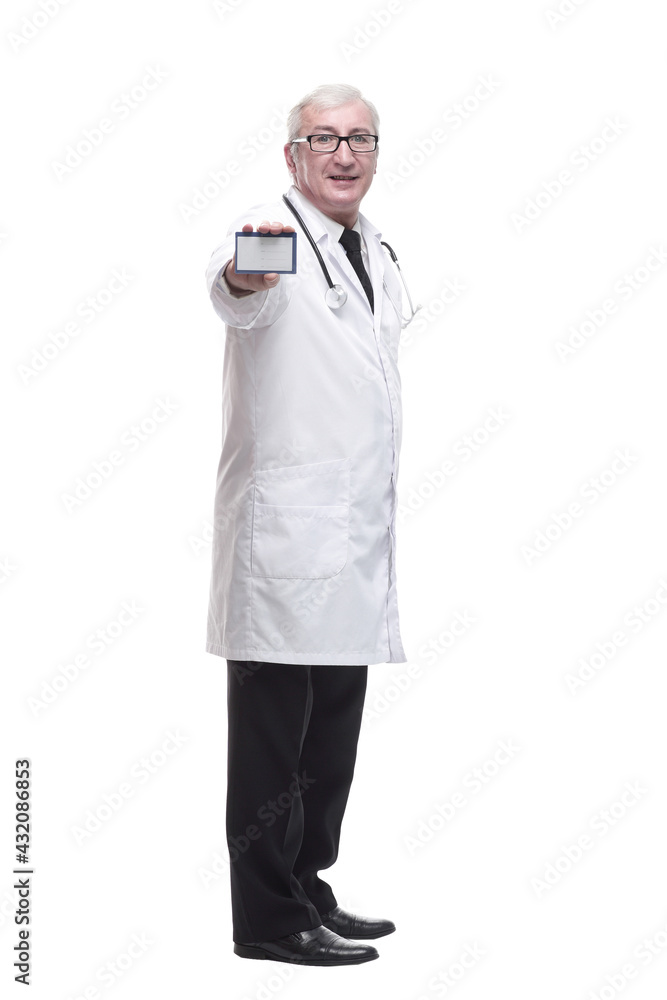 in full growth.qualified mature doctor showing his visiting card . in full growth.qualified mature doctor showing his visiting card .