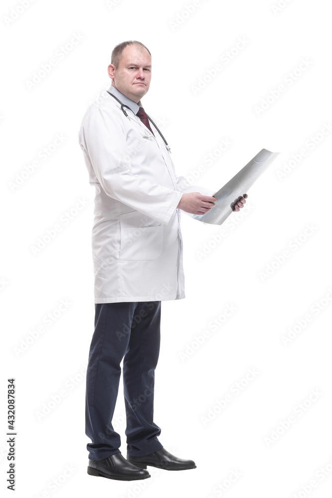in full growth. qualified doctor looking at an x-ray . in full growth. qualified doctor looking at an x-ray .
