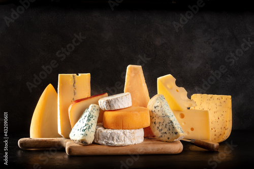 Organic cheeses on a black background