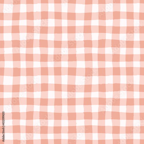 Check pattern in earthy pink. Vector seamless repeat of hand drawn checked gingham design. Cute and trendy geometric illustration.