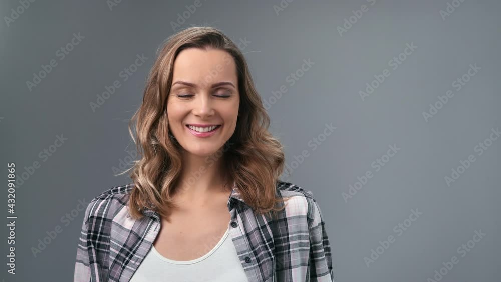 Portrait adorable young blonde casual lady in checkered shirt laughing having positive emotion Portrait adorable young blonde casual lady in checkered shirt laughing having positive emotion