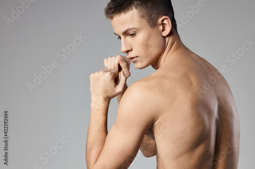 athletic men muscled arm muscles naked back gray background model 