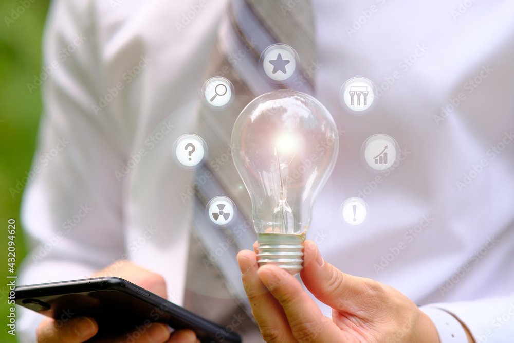 businessman holding light bulb and technology innovation concept businessman holding light bulb and technology innovation concept