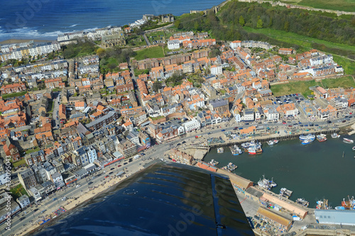 Scarborough is a resort town on England’s North Sea coast. Its 2 bays with sandy beaches are split by a headland bearing the 12th-century Scarborough Castle.