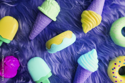 Plastic ice cream on blue background