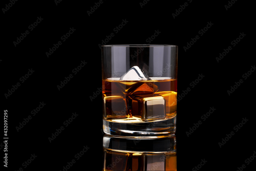 Whiskey with steel cooling cubes on dark glass background - obrazy, fototapety, plakaty 