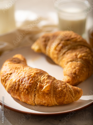 French croissant with jam. morning breakfast. On a light background