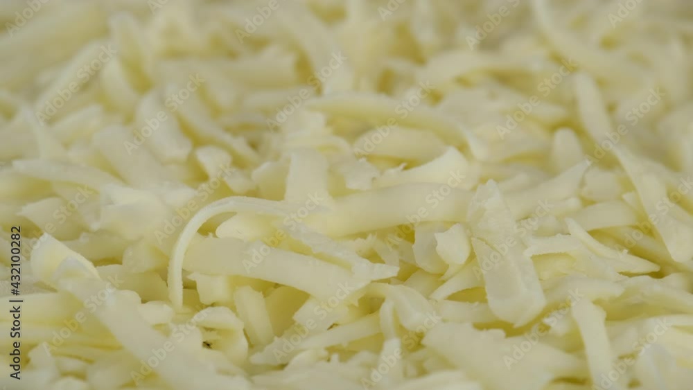 put grated mozzarella cheese close up, Sliding shot. pizza grated mozzarella cheese. 4K UHD video put grated mozzarella cheese close up, Sliding shot. pizza grated mozzarella cheese. 4K UHD video