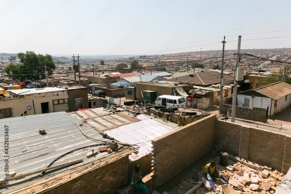 Naklejka premium High Angle rooftop view of low income houses in Alexandra township Johannesburg South Africa