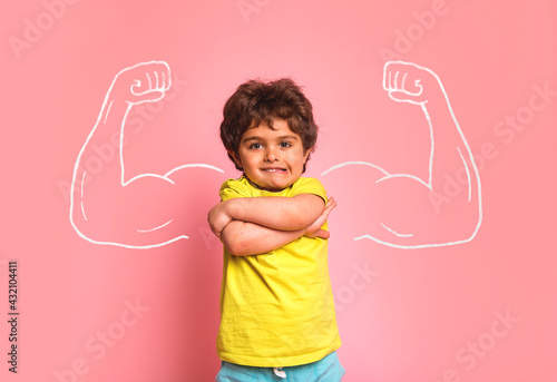 Successful kid in elementary school in front of muscle. Nerd kindergarten kid girl showing biceps. Dream, confidence, success, possible, innovation. Go back elementary school.