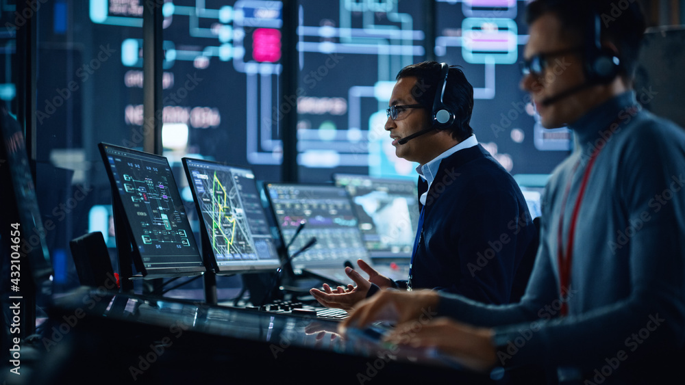 Portrait of Professional IT Technical Support Specialist Working on  Computer in Monitoring Control Room with Digital Screens. Employee Wears  Headphones with Mic and Talking on a Call. Stock Photo | Adobe Stock