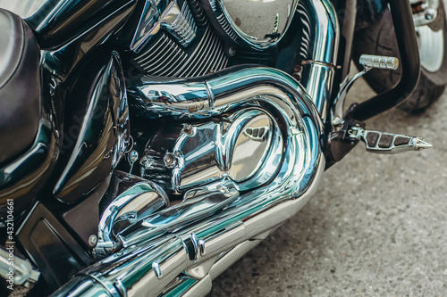 Chromed motorcycle engine part. Motorcycle exhaust system © uladzimirzuyeu