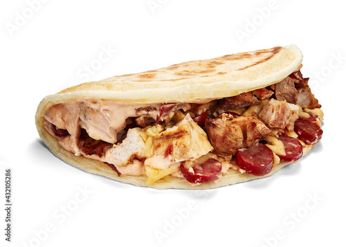 closed pizza with big toppings isolate on white background