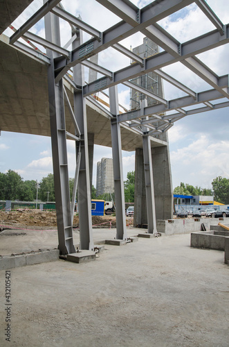 Building construction erection of metal frame structures and reinforced concrete foundation