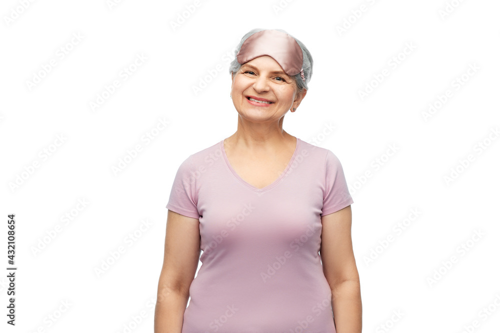old people concept - portrait of smiling senior woman in pajamas and eye sleeping mask over white background old people concept - portrait of smiling senior woman in pajamas and eye sleeping mask over white background