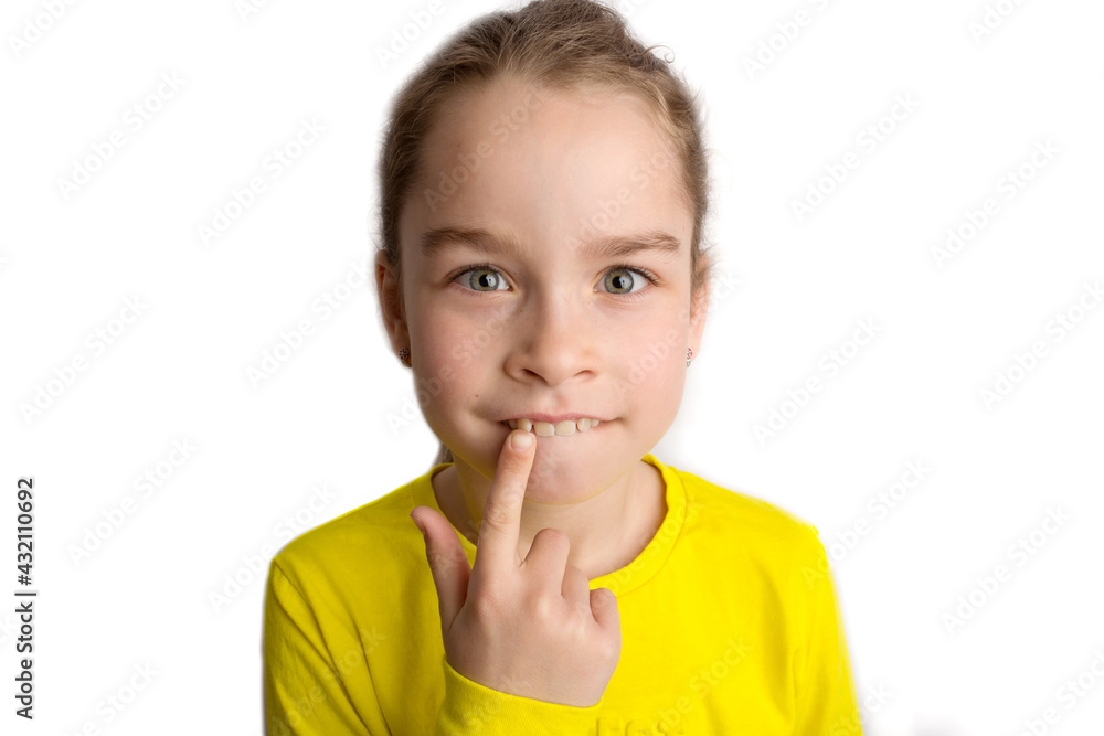 Little girl stands on a white background with a beautiful smile, children crooked teeth, pediatric dentistry. Crooked teeth close-up. Correction of malocclusion is required. Little girl stands on a white background with a beautiful smile, children crooked teeth, pediatric dentistry. Crooked teeth close-up. Correction of malocclusion is required.