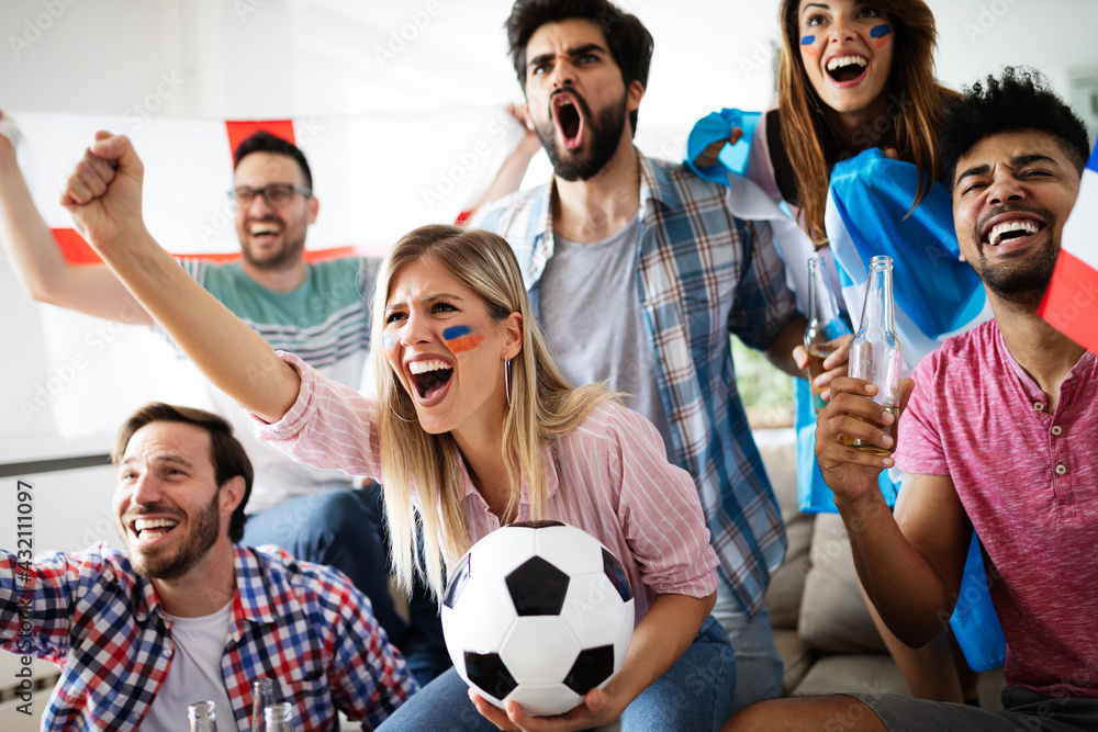 Group of multi-ethnic people celebrating football game