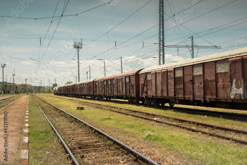 Railway track with freight trains and nature