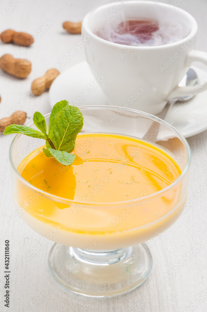delicious Pana cotta dessert with mango and hot tea delicious Pana cotta dessert with mango and hot tea