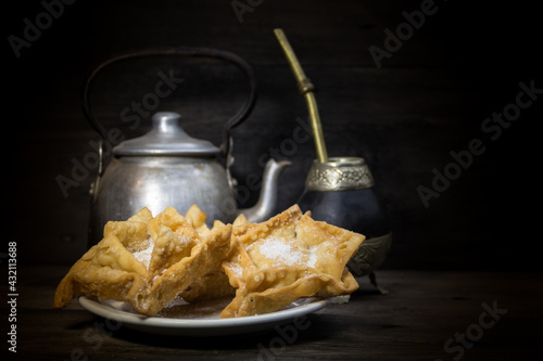 fried quince and sweet potato pastries with mate photo