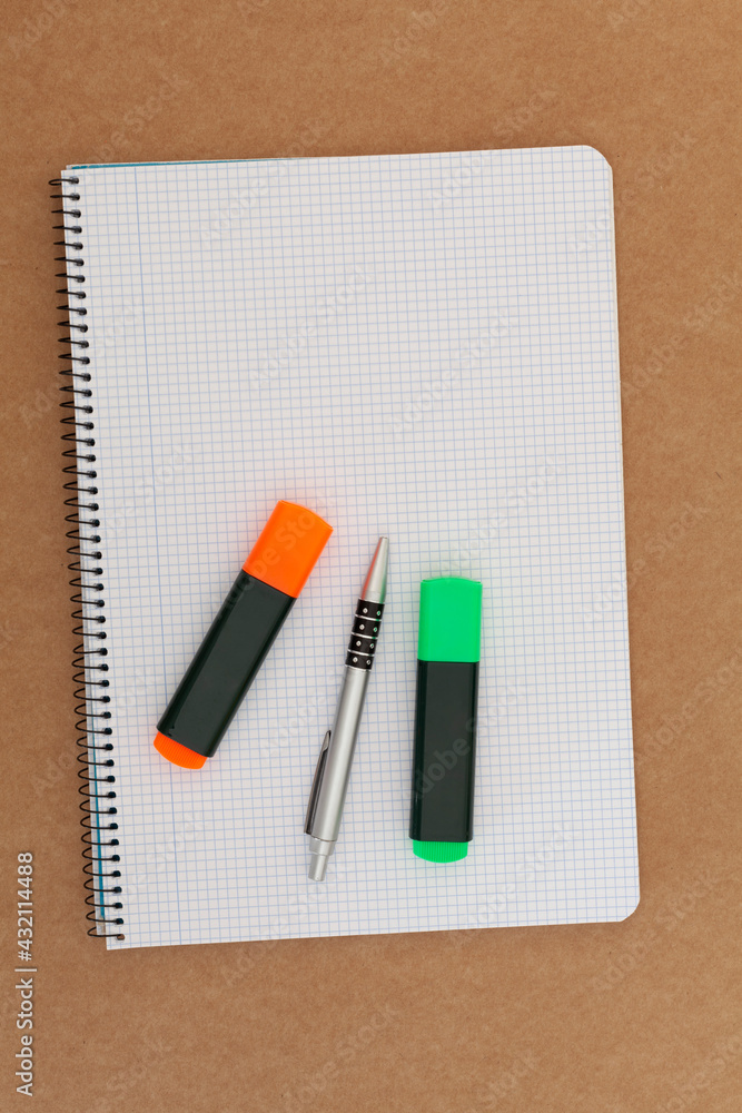 Notebook, pen and markers Notebook, pen and markers