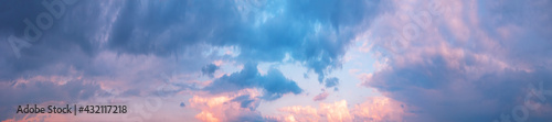 Panorama of cloudy sky with pink clouds