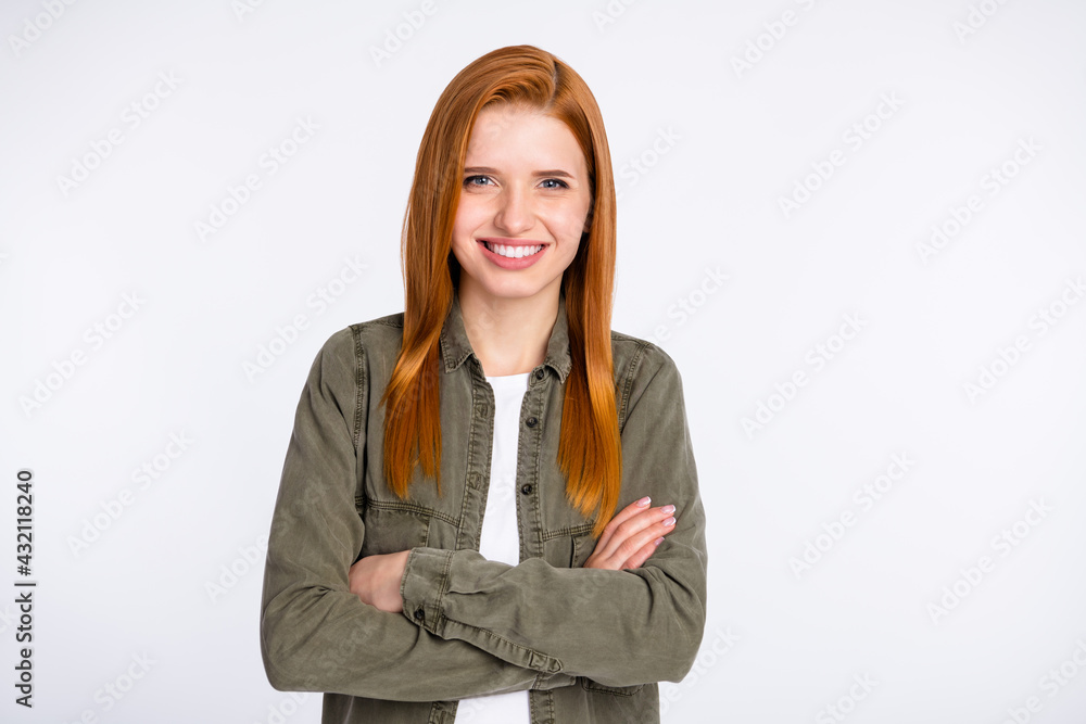 Photo of happy good mood smiling cheerful young girl with folded hands wear jacket isolated on grey color background Photo of happy good mood smiling cheerful young girl with folded hands wear jacket isolated on grey color background