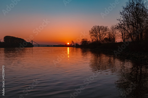 Beautiful sunset with reflections near Metten, Danube, Bavaria, Germany © Martin Erdniss