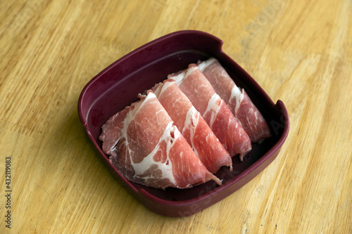 fresh raw pork slide on plastic plate on isolate for making food