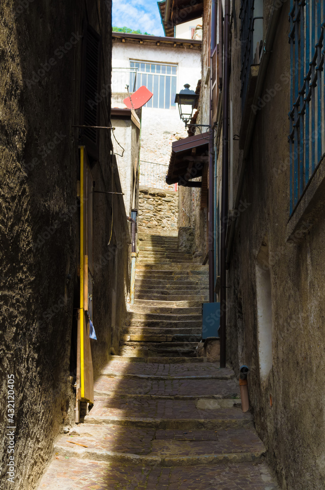 Empty narrow alley amidst buildings