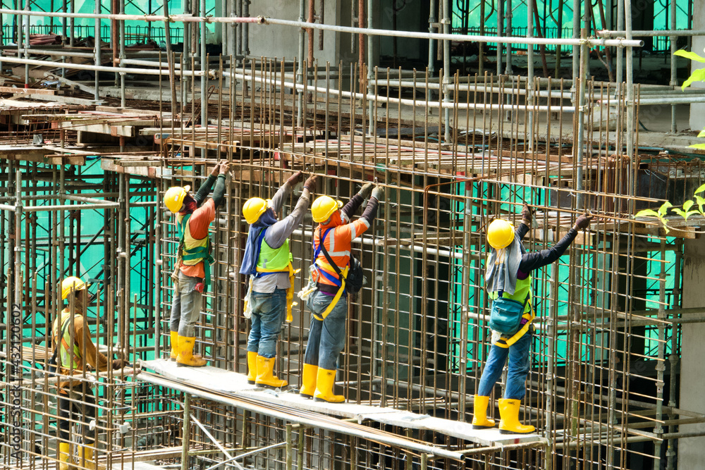 Construction workers at reinforced concrete reinforcement Construction workers at reinforced concrete reinforcement