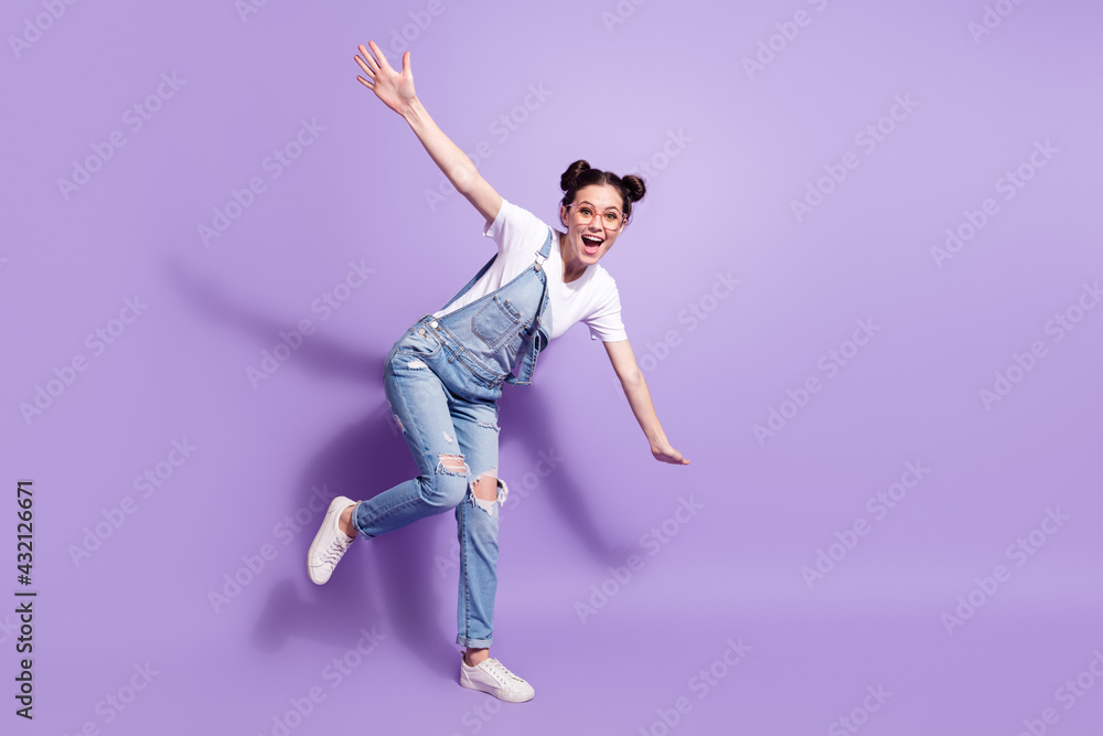 Full body photo of young attractive girl happy positive smile have fun isolated over violet color background Full body photo of young attractive girl happy positive smile have fun isolated over violet color background