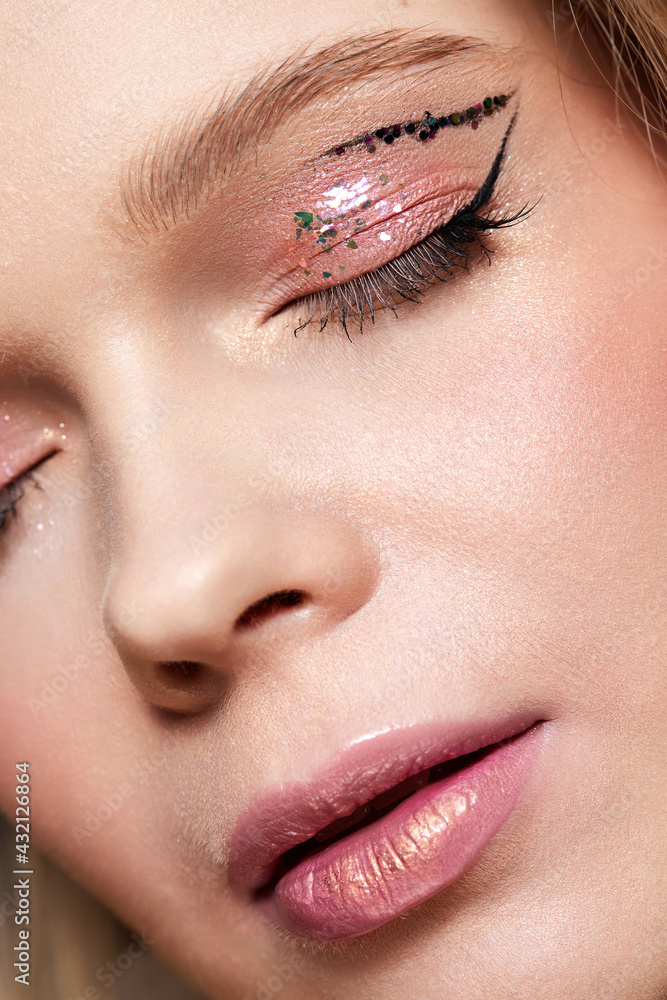 portrait of beautiful blonde woman with pink makeup