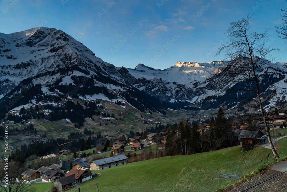 Frühling im Berner Oberland, Adelboden mit Grosser Lohner, Steghorn und Wildstrubel, frisch verschneit, snow from yesterday in spring on the Swiss mountains, illuminated peaks