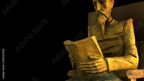 Don Quixote of La Mancha reads a book-Dx from below - 3d model animation on a black background photo