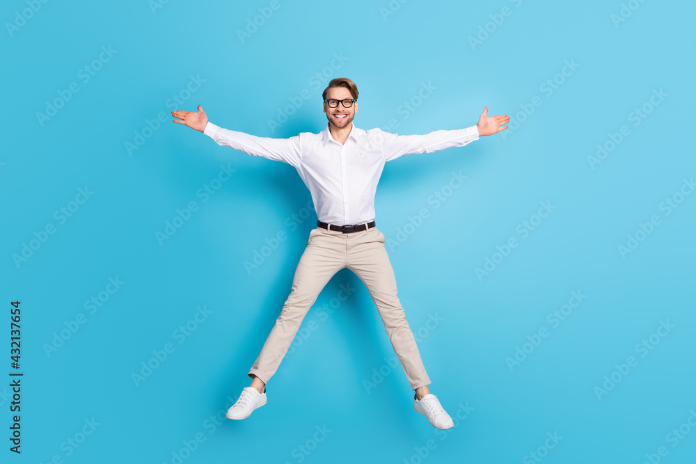 Full length body size view of attractive successful cheerful man jumping like star isolated over bright blue color background