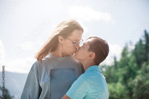 A child embraces mom in the...