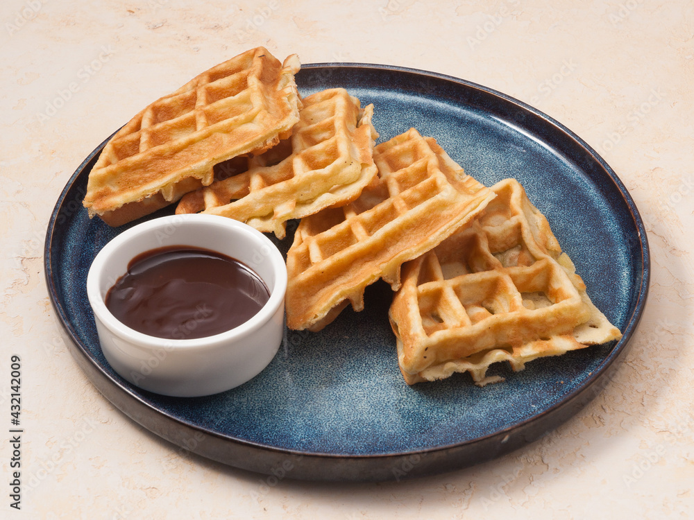 tasty waffle with chocolate topping. Concept: Breakfast tasty waffle with chocolate topping. Concept: Breakfast