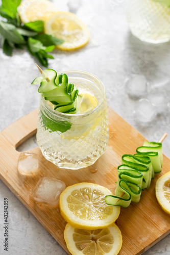 Refreshing iced drink with lemon and cucumber