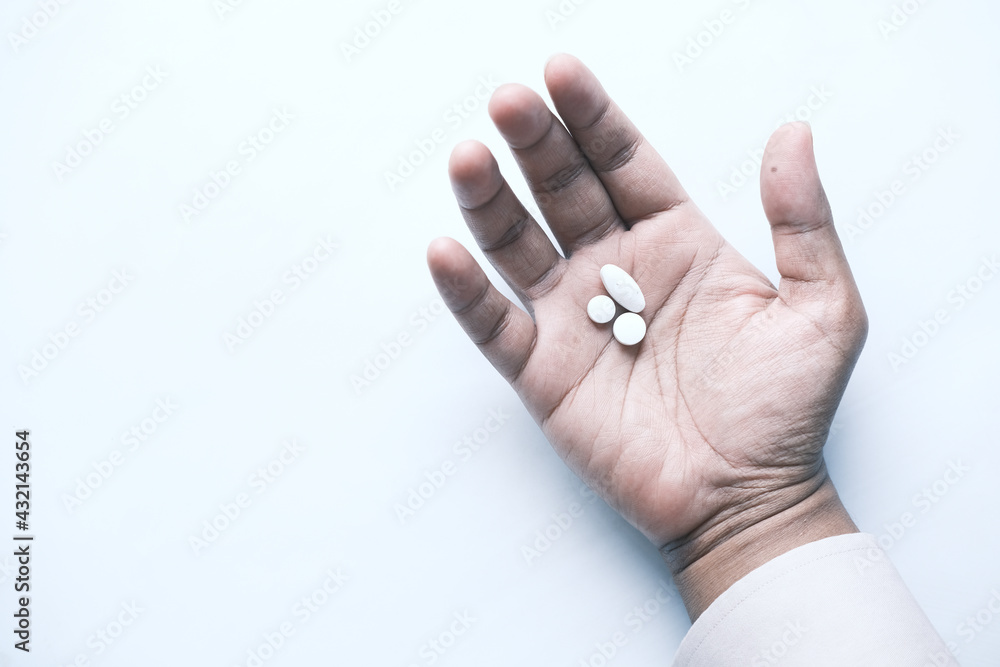 top view of pills on palm of hand top view of pills on palm of hand