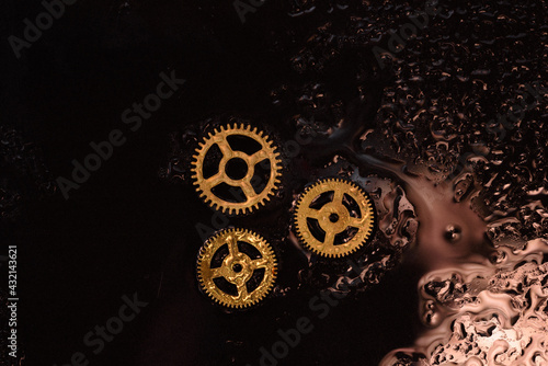 Clock gears. Reflections and drops of water. 