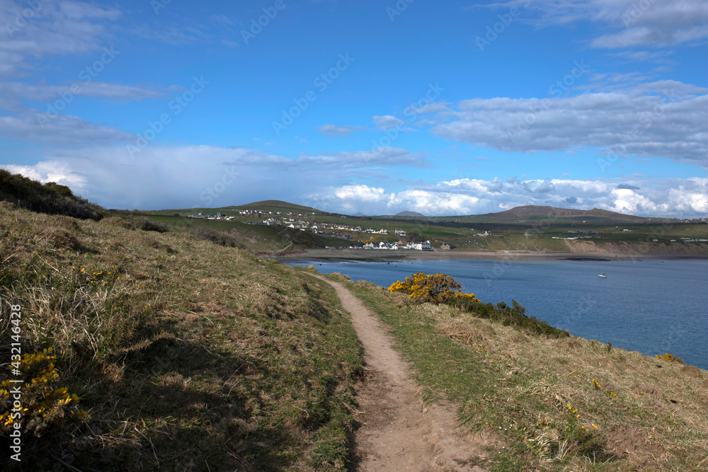 LLyn Peninsula coastal path in Wales.  With the village of Aberdaron in the background