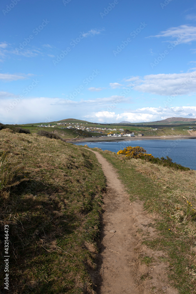 LLyn Peninsula coastal path in Wales.  With the village of Aberdaron in the background