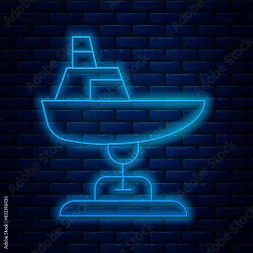 Glowing neon line Swing boat on the playground icon isolated on brick wall background. Childrens carousel with boat. Amusement icon. Vector