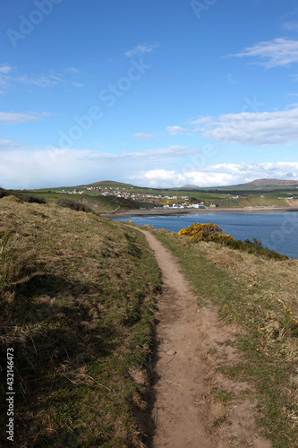 LLyn Peninsula coastal path in Wales.  With the village of Aberdaron in the background
