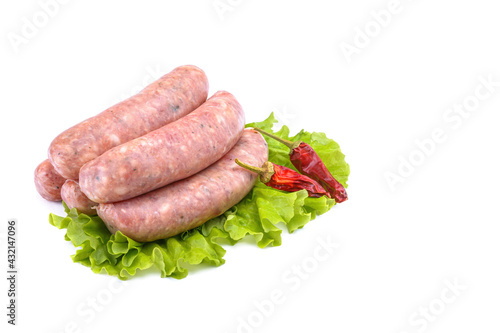 Raw pork sausages.Grilled sausages in close-up, isolated on a white background.Selective focus.