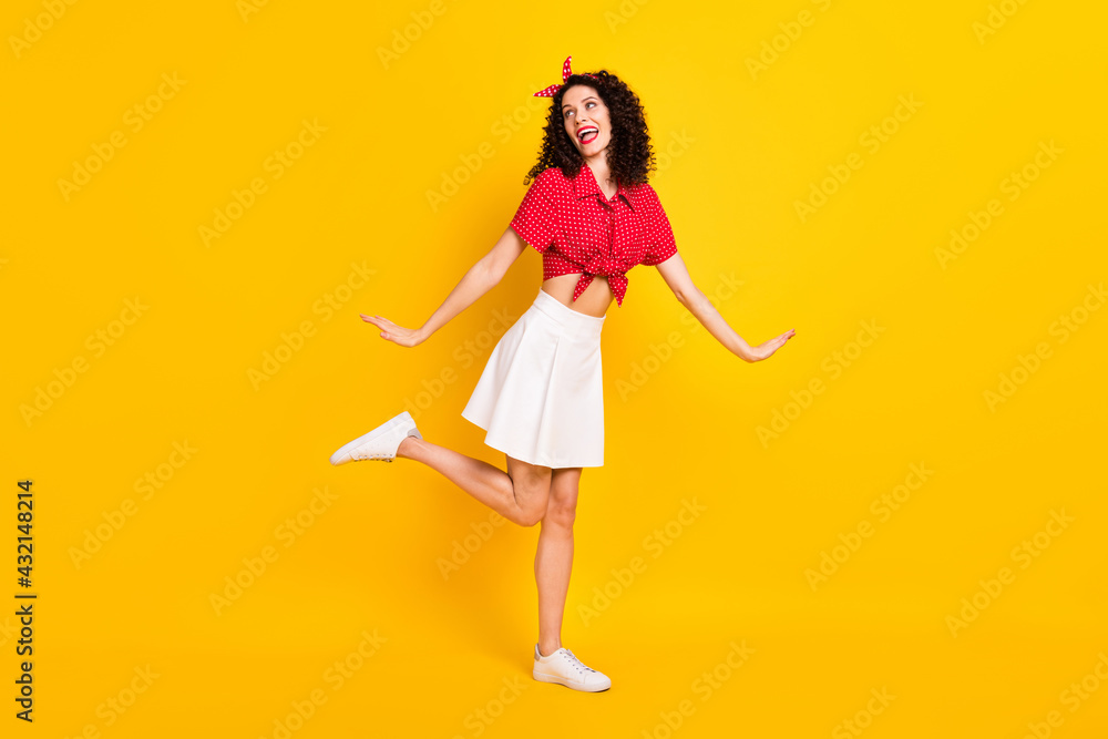 Full size photo of dreamy cute young woman look empty space sweet lovely mood isolated on yellow color background Full size photo of dreamy cute young woman look empty space sweet lovely mood isolated on yellow color background